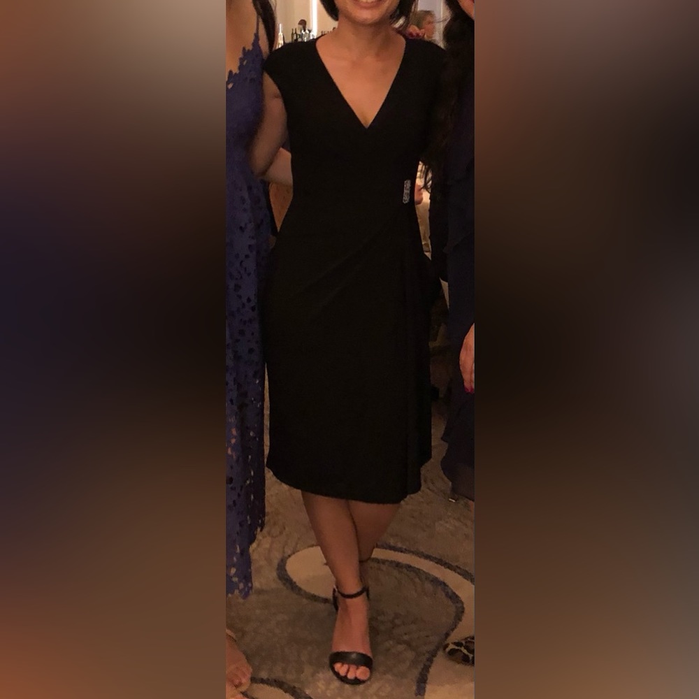 Black cocktail dress with silver pendant (Pictured in the middle)